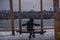 The girl swings on it and looks at the incredible view of Kyiv.