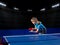 Girl table tennis player at sports hall