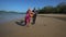 Girl takes guitar out of guitarist shows victory on beach