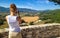 Girl takes pictures of the landscape of Provence