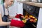 Girl taking cake with hot freshly baked muffins from the oven