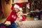 Girl taking Christmas photo with puppy