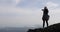 Girl Taking Photo Of Landscape From Mountain Top On Cell Smart Phone, Female Tourist With Backpack Standing On Cliff