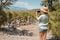 girl taking photos on smartphone of the ruins of Roman amphitheater in the ancient city of Phaselis in Turkey. Sightseeing