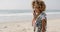 Girl Talking At Mobile Phone On The Beach