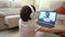 Girl talking by videoconference to her mother, who is isolated by Covid-19