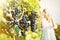 Girl tasting white wine among vineyards