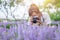 Girl teen enjoy holiday with photograph beautiful flower