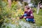 Girl teen picking Chaenomeles fruits