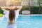 Girl teen relax at swimming pool holiday lifestyle