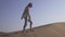 Girl teenager runs around the sand on the slope of the dune in Rub al Khali desert United Arab Emirates stock footage