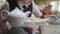 Girl teenager in a school uniform sitting at a table in the school cafeteria eating cakes and drinking tea, Close-up .