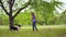 Girl teenager training her dog outdoors