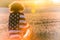 Girl Teenager Wrapped in USA Flag in Field at Sunset