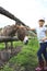 Girl tenderly stroking a donkey.