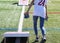 Girl throwing bean bags while playing cornhole