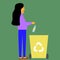 Girl throws plastic bottle in dumpster