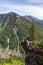 Girl on Top of Cliff with Beautiful View of Canadian Mountain Landscape