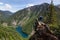 Girl on Top of Cliff with Beautiful View of Canadian Mountain Landscape