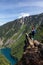 Girl on Top of Cliff with Beautiful View of Canadian Mountain Landscape