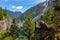 Girl on Top of Cliff with Beautiful View of Canadian Mountain Landscape