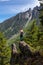 Girl on Top of Cliff with Beautiful View of Canadian Mountain Landscape