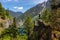 Girl on Top of Cliff with Beautiful View of Canadian Mountain Landscape