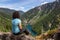 Girl on Top of Cliff with Beautiful View of Canadian Mountain Landscape