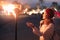 Girl touches the fire torch. Pagan beliefs, spirituality, and the fire-worship concept