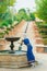 Girl touches the water in an ancient fountain