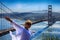 Girl tourist on the background of the Golden Gate Bridge in San Francisco