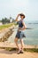 Girl tourist Galle hat sunglasses sunny joy lighthouse