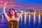 Girl tourist pink wig in Ibiza nightlife at sunset