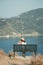 Girl tourist sitting on a bench at  the observation deck