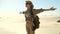 a girl tourist with a travel backpack spread her arms to the sides, Desert