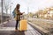 Girl tourist waits for the train