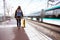 Girl tourist waits for the train