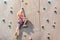 The girl on the tower of climbers conquers the peaks in an extreme park