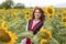 Girl in a traditional Bulgarian dress in a field of sunflowers