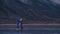 The girl train on ice speed skating. The child skates in the winter in blue sportswear suit, sport glasses. Children