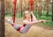Girl trains in a hammock for aero yoga