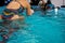 Girl trains on a pedal boat in the pool