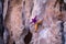 A girl trains strength and endurance on rocks