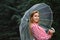 Girl with transparent umbrella in rainy weather