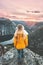 Girl traveling alone enjoying sunset mountains