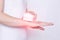 Girl treats a sore wrist joint with the help of physiotherapy and magnet laser treatment, white background, damage