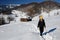 Girl trekking in winter mountains, Romania