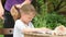 Girl tries to erase eraser drawing is mother combing her hair