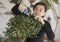 Girl trimming olive tree bonsai