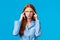 GIrl trying focus and think straight. Serious-looking thoughtful redhead creative woman squinting suspicious and